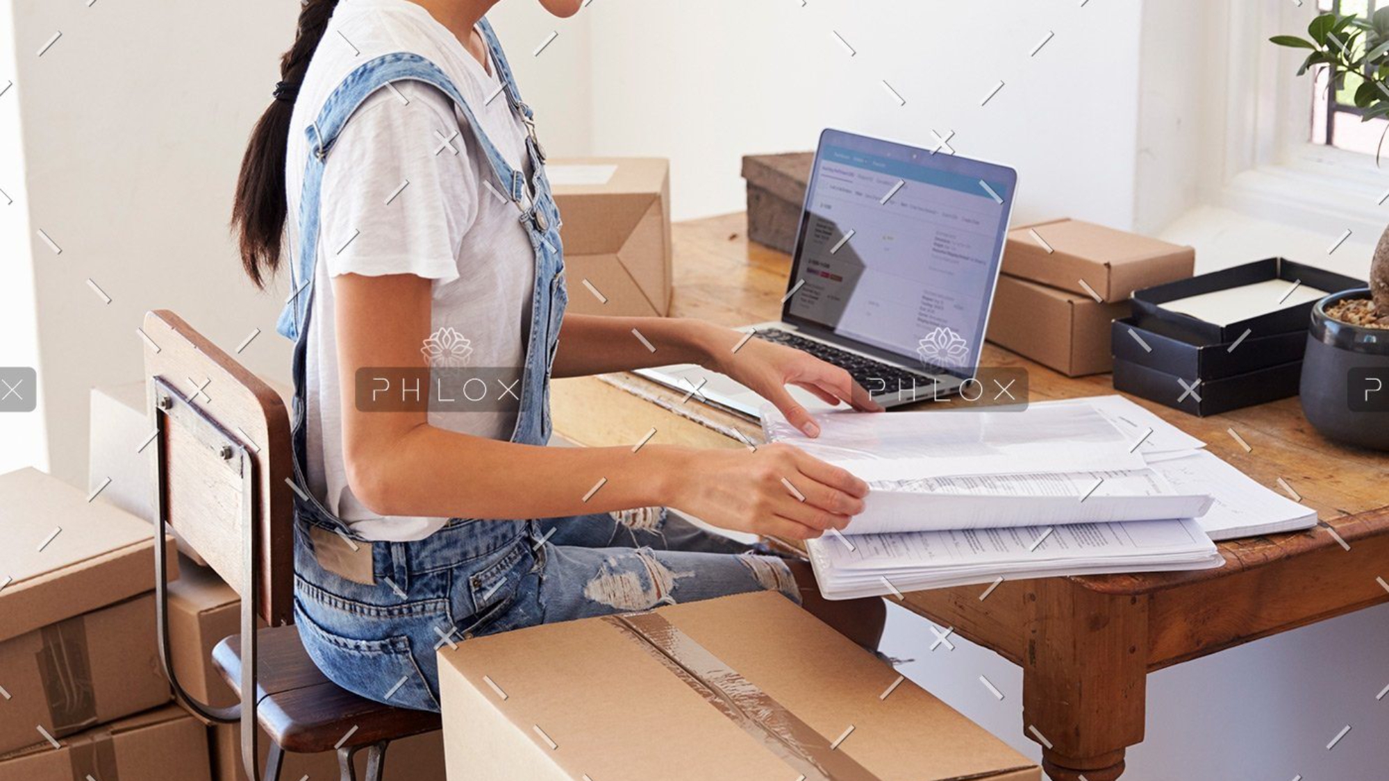 demo-attachment-139-woman-running-business-from-home-working-on-PCZKTN9